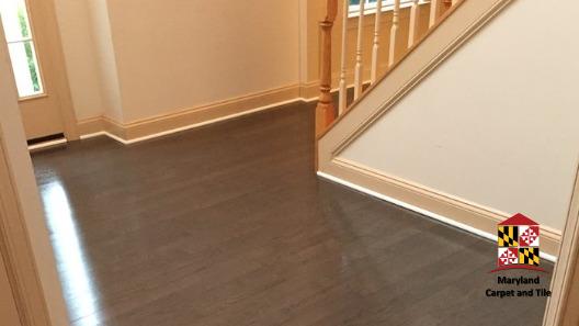 Beautiful hardwood flooring installation at the entrance to this home